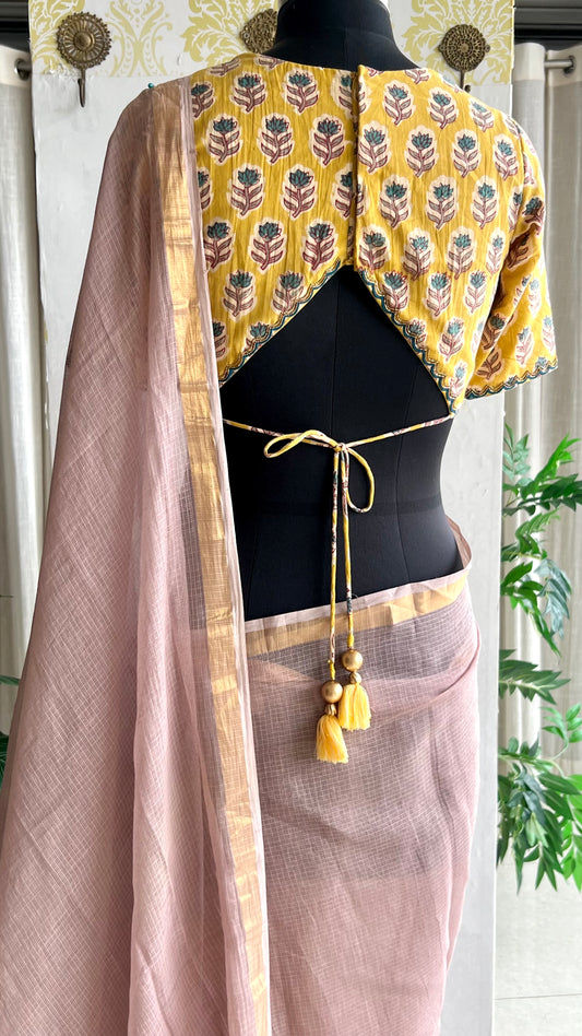 Light peach mul kota saree with yellow hand work blouse