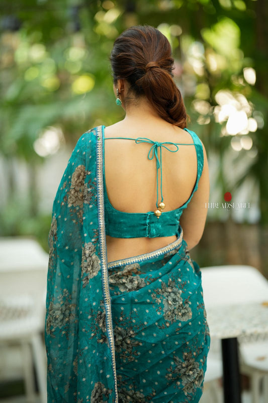 Peacock blue organza saree with velvet blouse