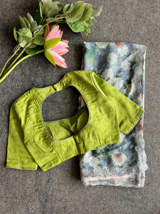 Grey floral chiffon saree with green blouse