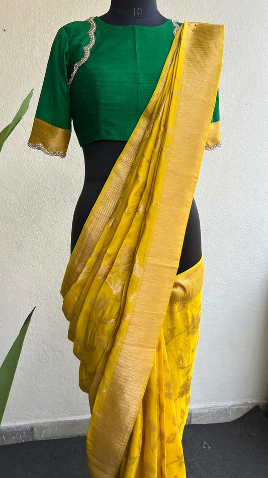 Yellow banarasi saree with green silk hand embroidery blouse