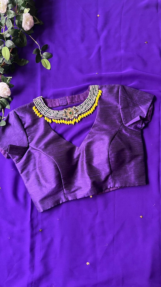 Purple georgette saree with purple jewel neck hand work blouse
