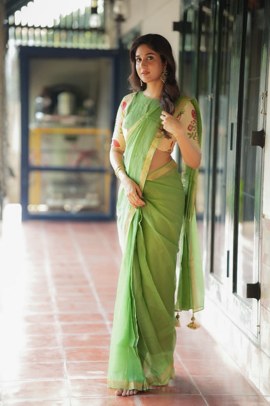 Green pure kota saree with cream hand work blouse