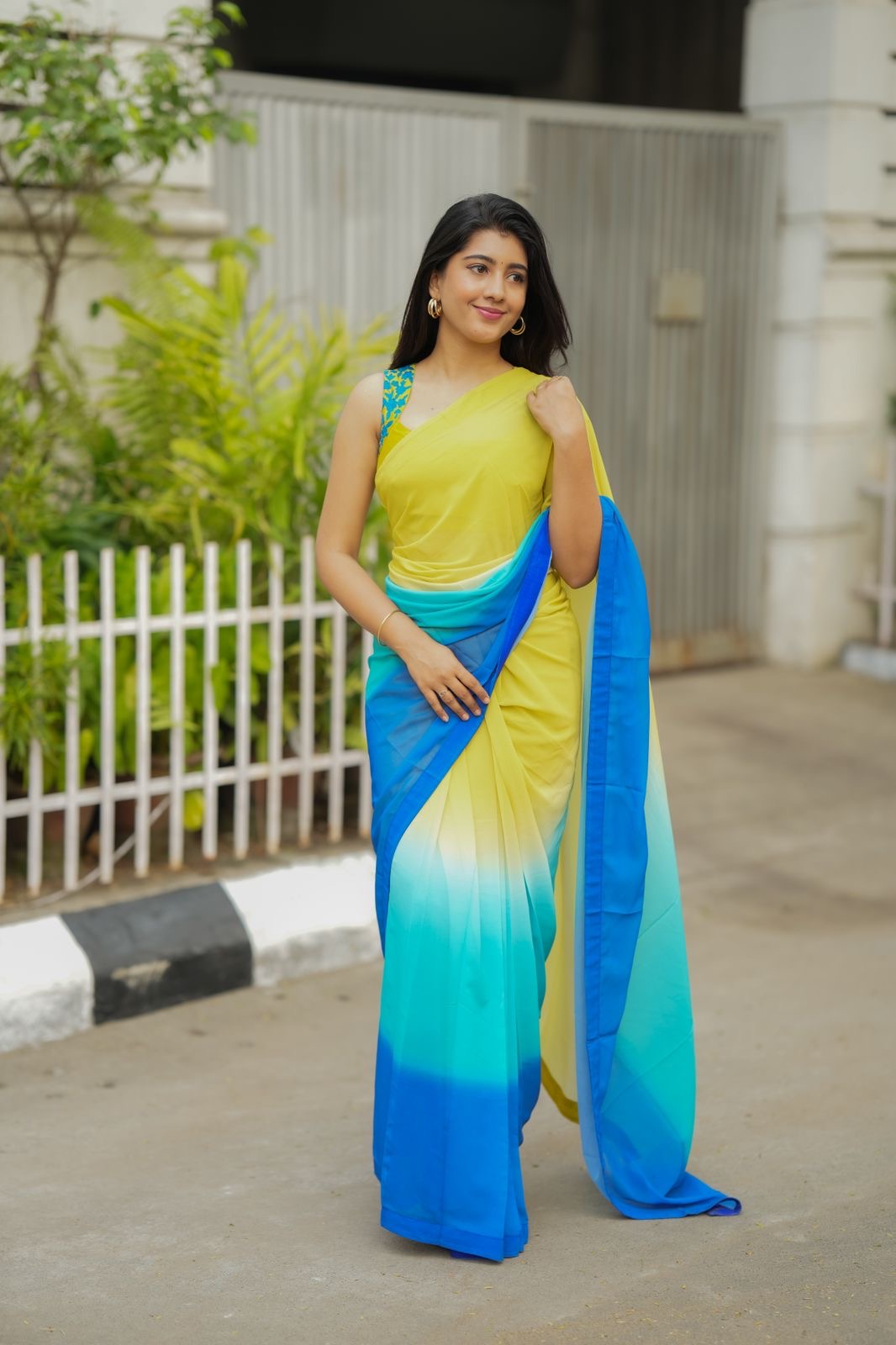 Multi georgette saree with yellow hand made blouse