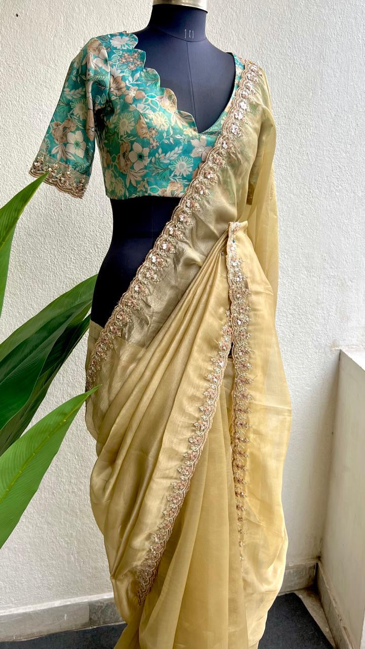 Golden soft tissue saree with blue floral embroidery blouse