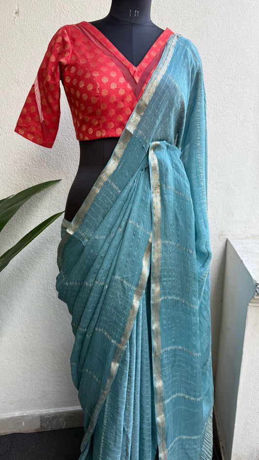 Blue chiffon silk saree with orange banarasi blouse