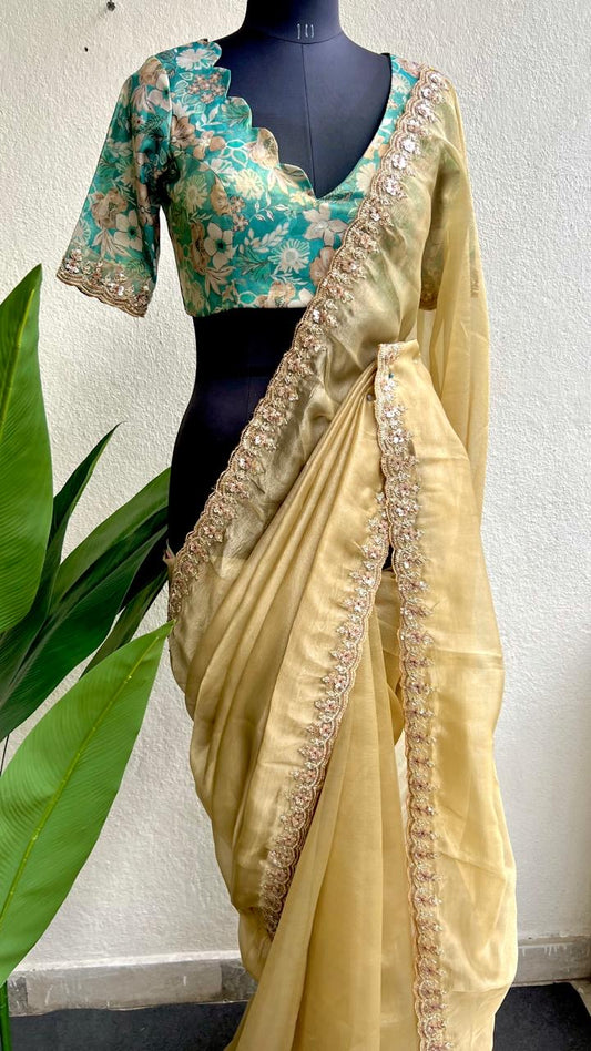 Golden soft tissue saree with blue floral embroidery blouse