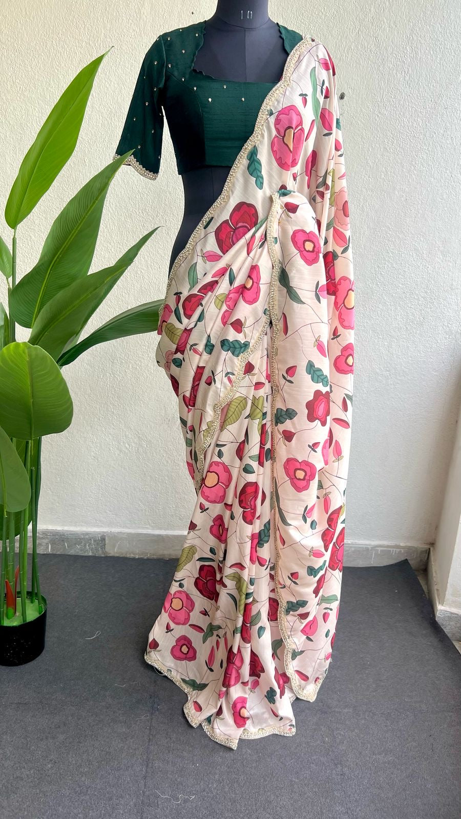 Half white floral kossa saree with green hand worked blouse