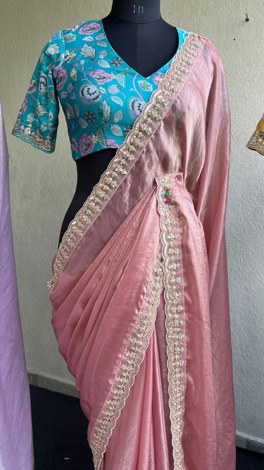 Peach soft tissue saree with cyan blue floral blouse