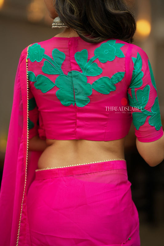 Pink organza saree with floral hand work blouse