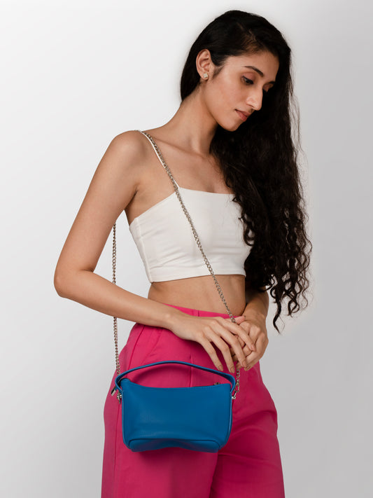 Women blue textured sling hand bag