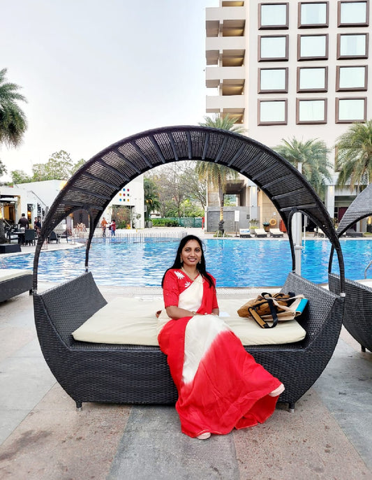 Cream & red saree with hand work blouse