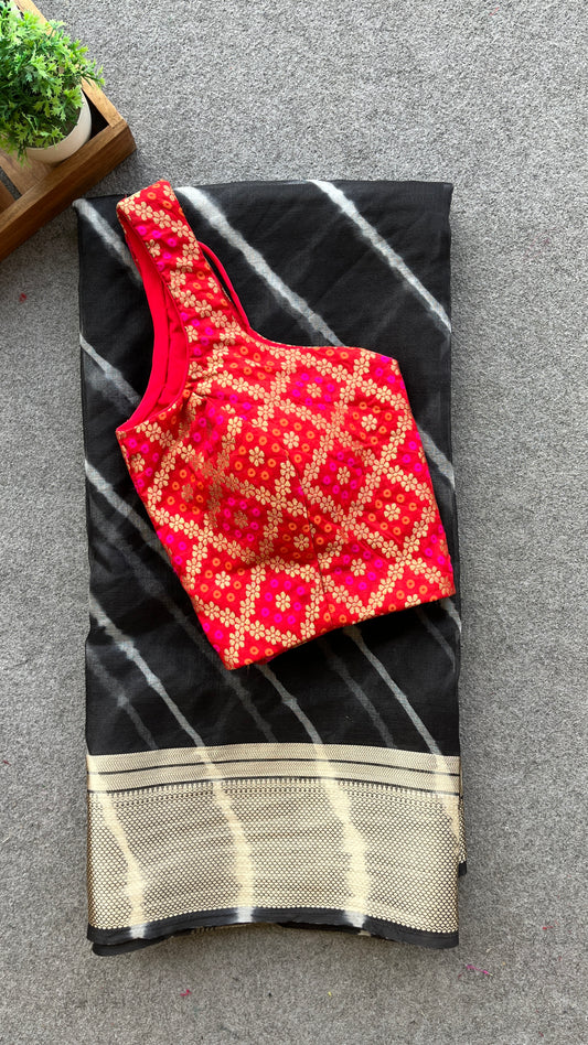 Black organza saree with red bandhini blouse