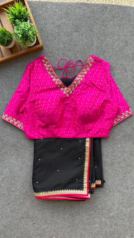 Black organza saree with pink ikkat blouse