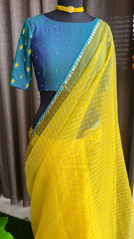 Yellow organza checked saree with handwork blouse