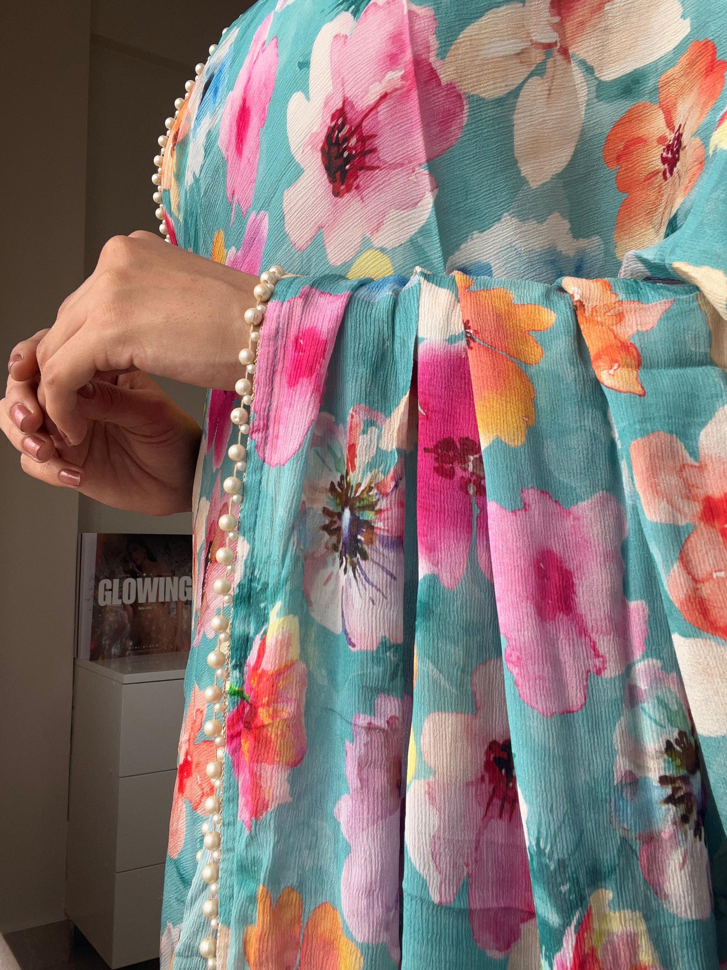 Blue floral chinnon saree with pearl hand work blouse