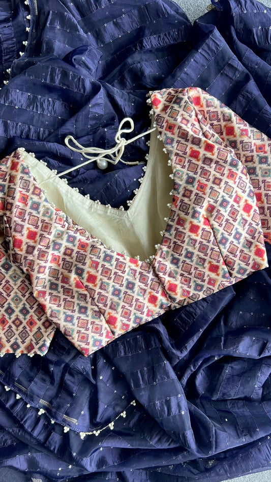 Midnight blue organza saree with pearl worked blouse