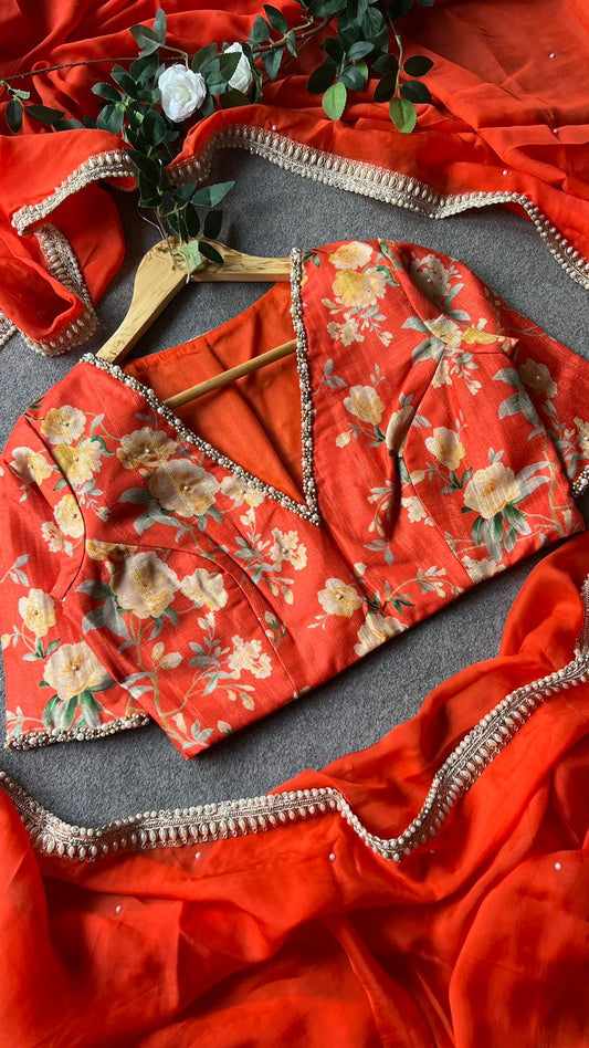 Orange organza saree with pearl hand work blouse