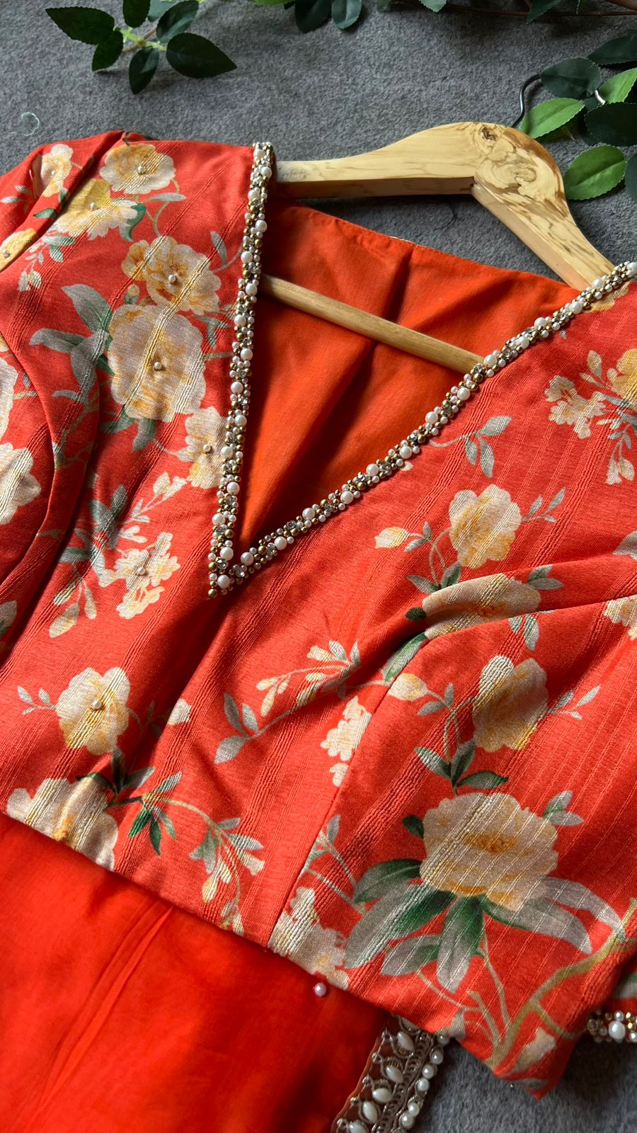 Orange organza saree with pearl hand work blouse