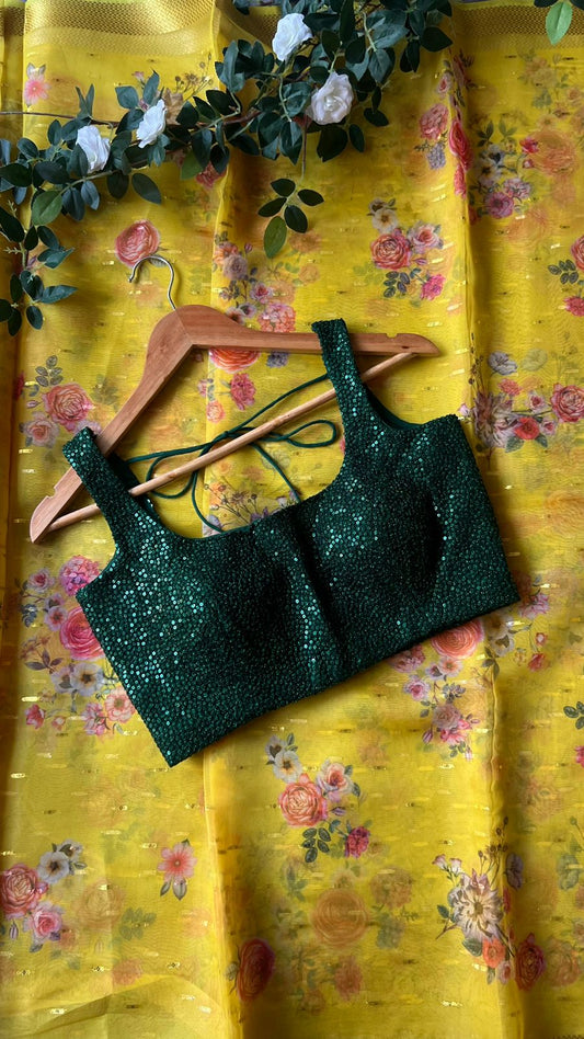 Yellow organza saree with green sequins blouse