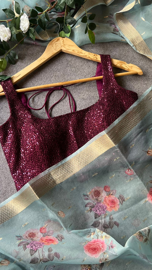 Blue organza saree with wine sequins blouse