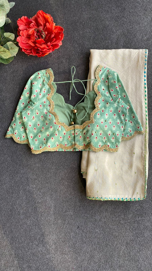 Beige silk designer saree with pista green embroidered blouse