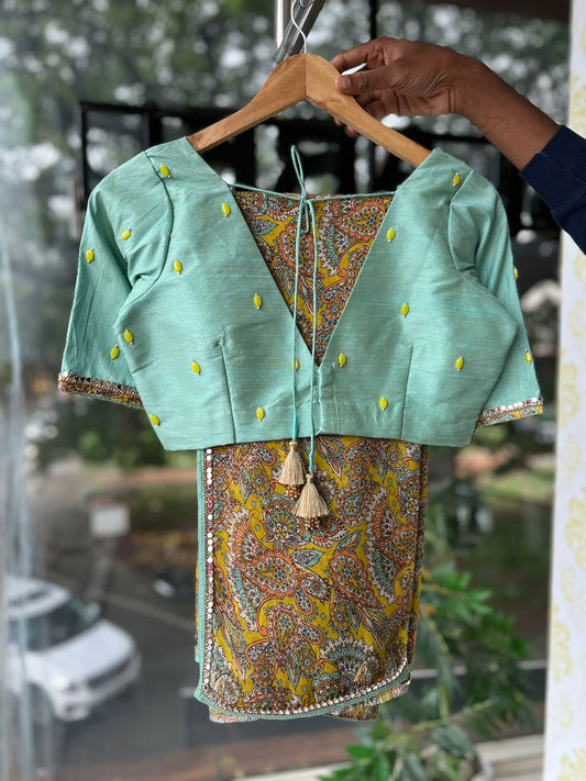 Fenugreek floral organza saree with hand worked blouse