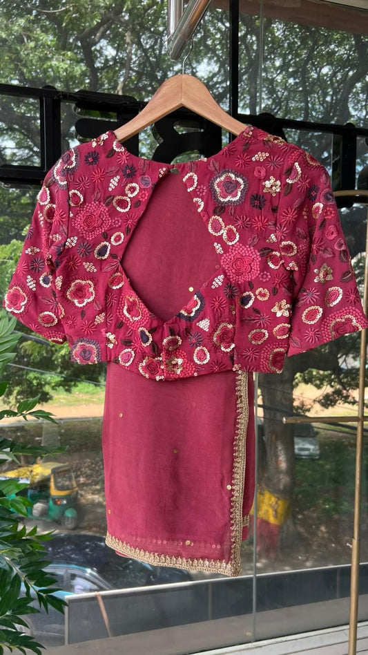Deep pink organza saree with embroidered blouse