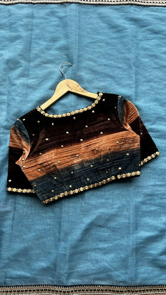 Blue organza saree with stripe velvet blouse