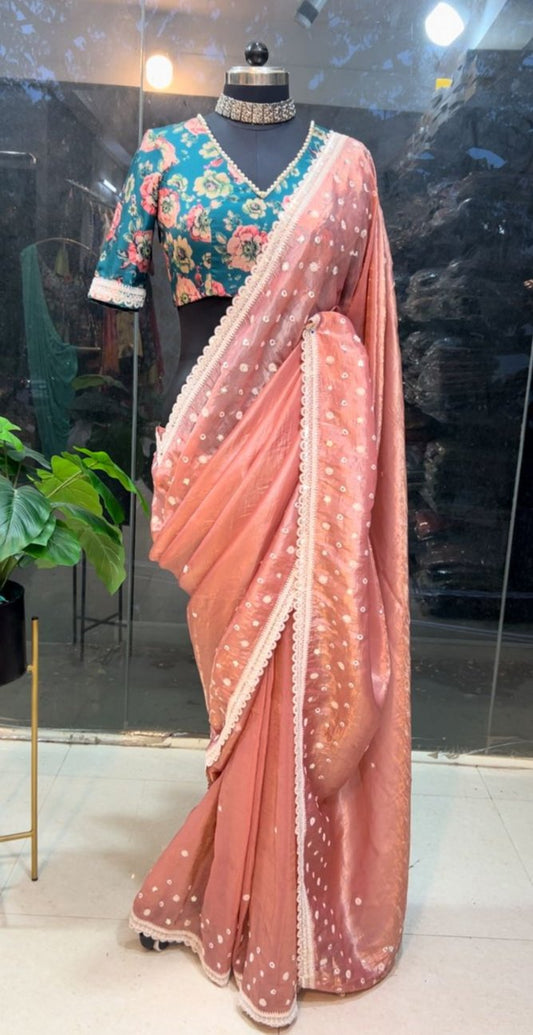 Peach soft glass tissue saree with green floral embroidery blouse