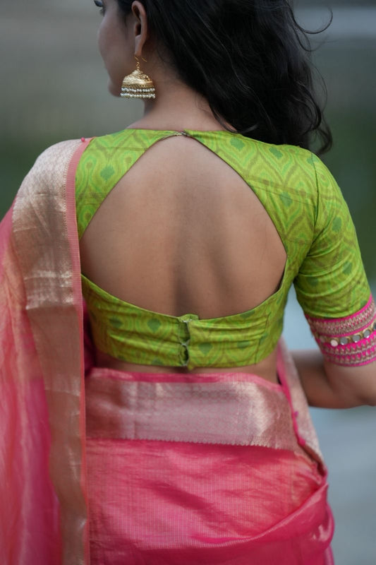 Pink & orange banarasi silk saree with parrot ikkat blouse
