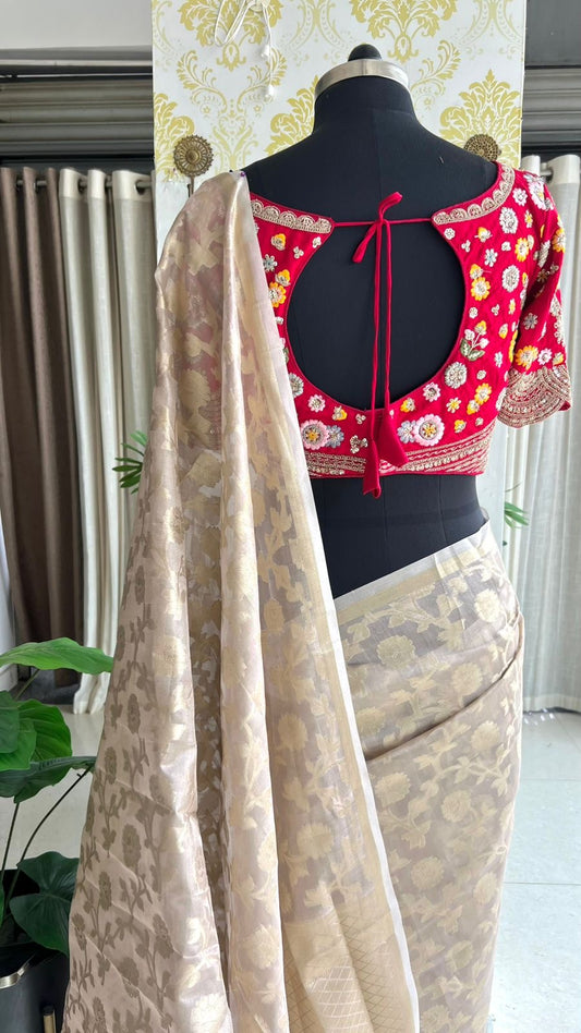 Half white banarasi saree with deep pink silk hand embroidery blouse