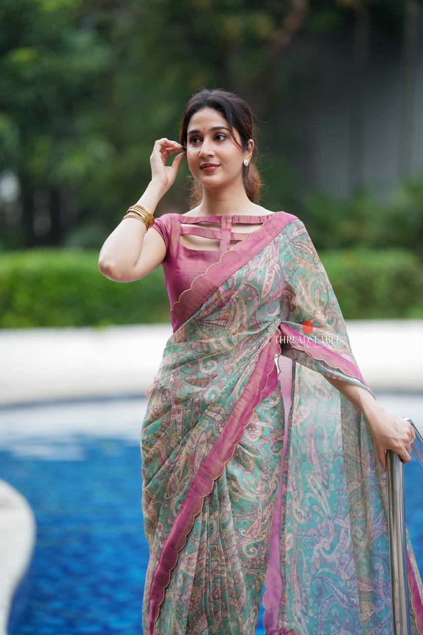 Jade green viscose jute saree with pink tissue blouse
