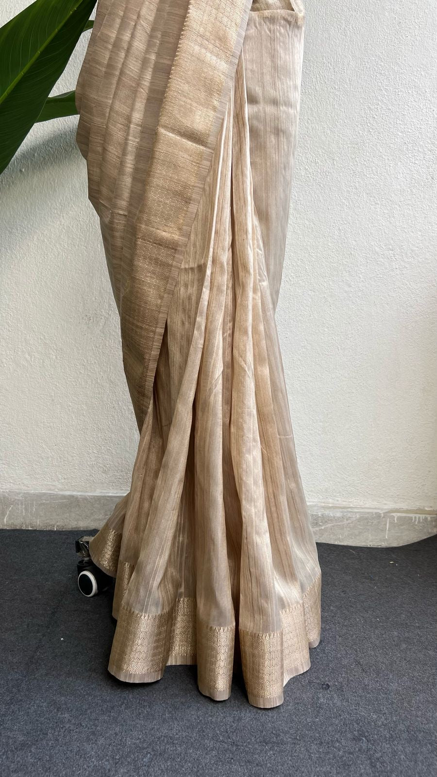 Golden cream tissue saree with black hand work blouse