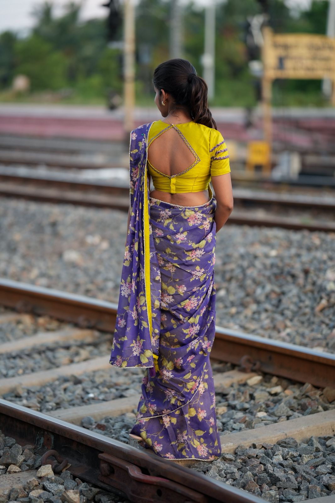 Blue floral tissue saree with lime hand work blouse