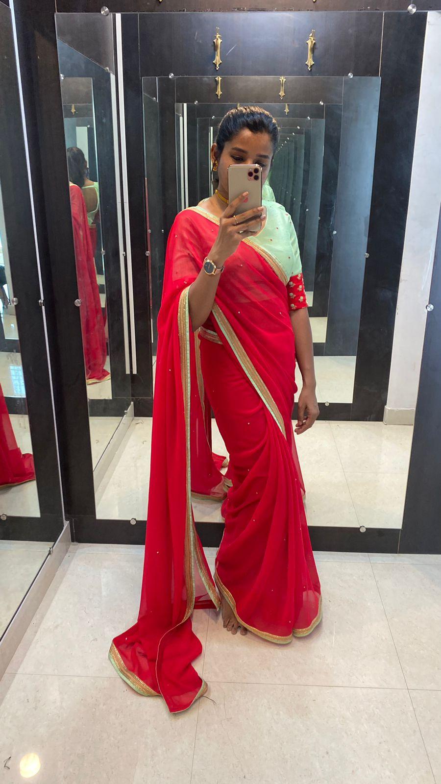 Red Georgette saree with sea green designer blouse - Threads