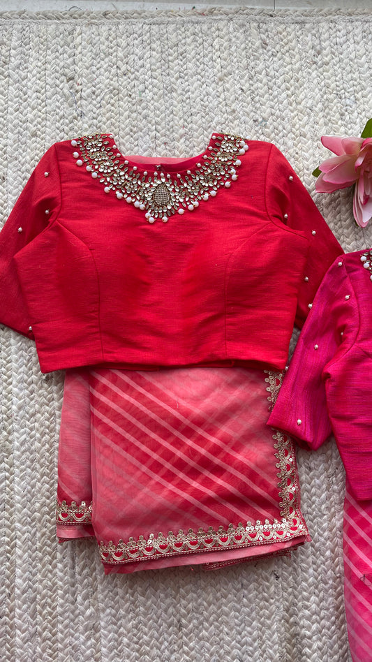 Red organza saree with jewel neck red blouse