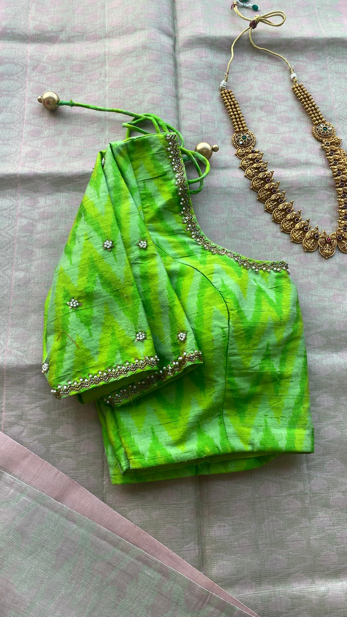 Cream white kanchipuram silk saree with hand worked blouse