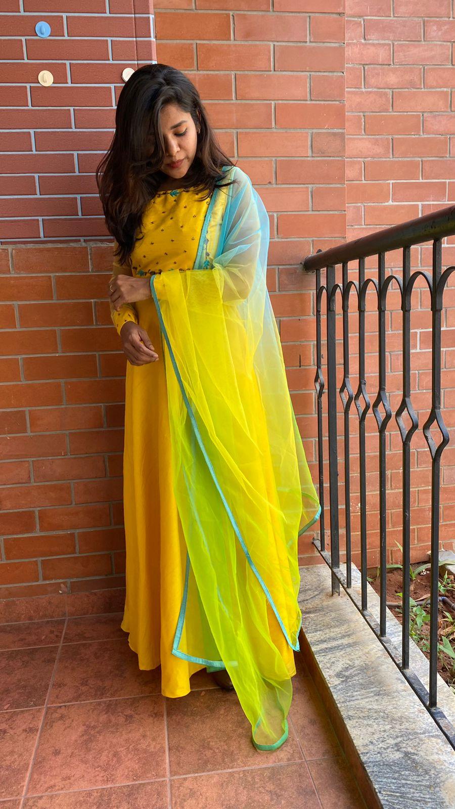 Yellow Bloom handworked top and a yellow Duppata salwar suit - Threads