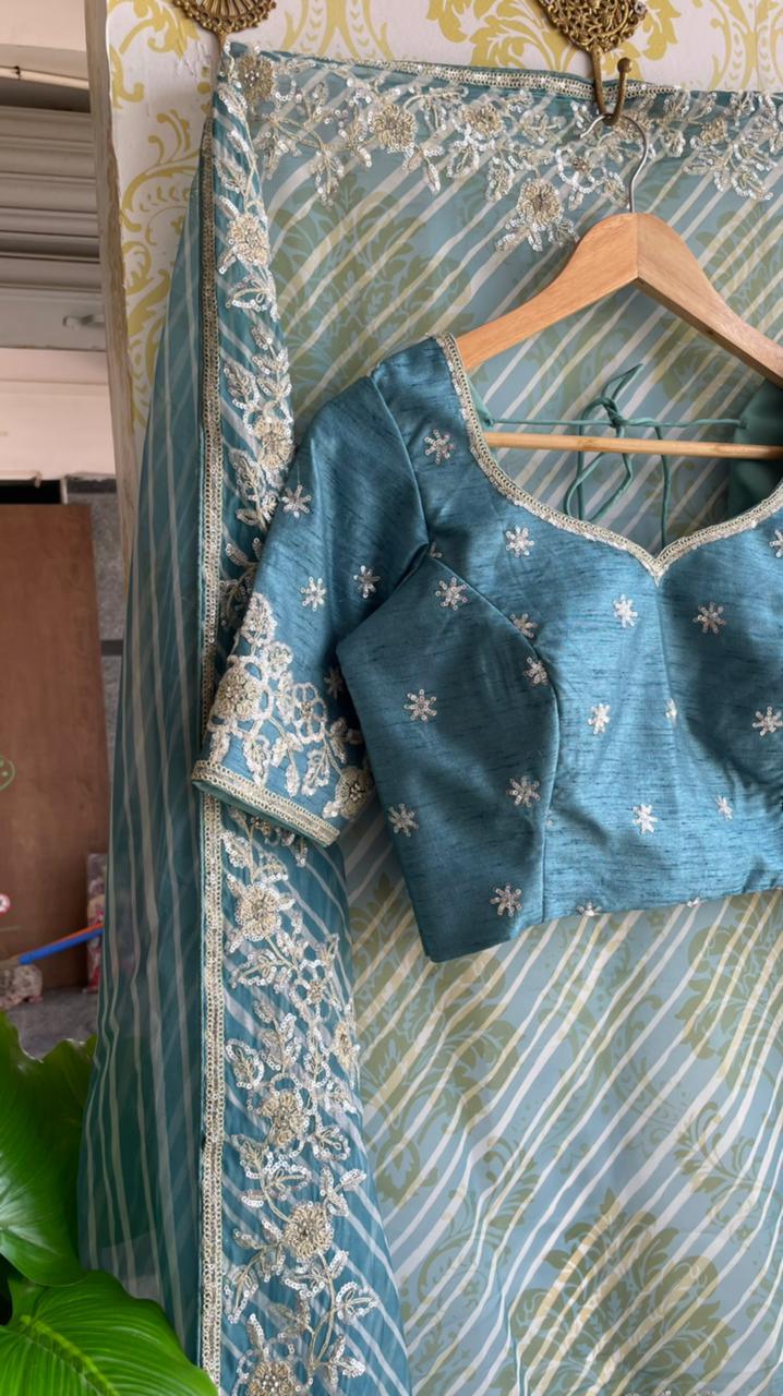 Lehariya Blue organza saree with blue hand worked blouse - Threads