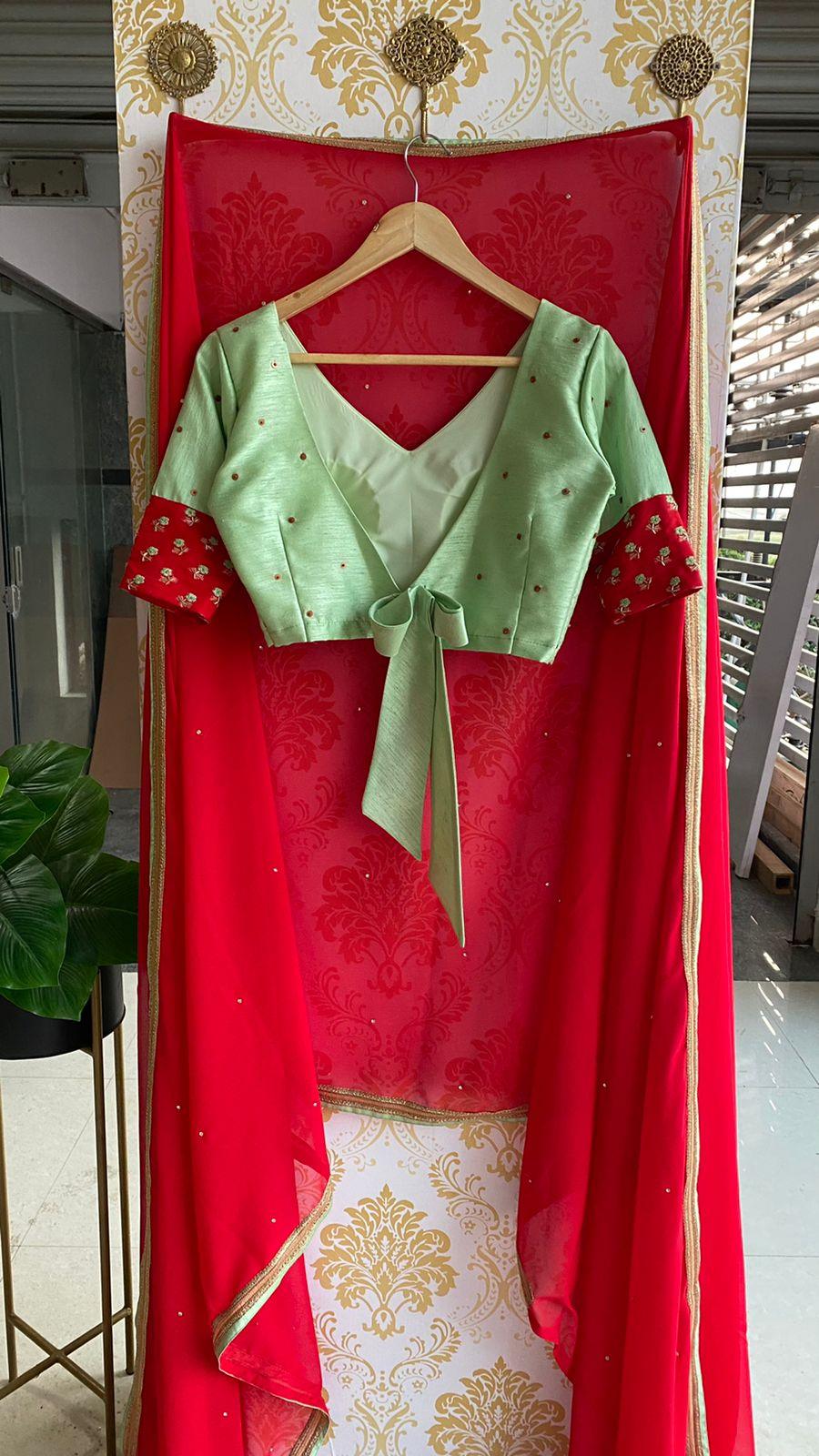 Red Georgette saree with sea green designer blouse