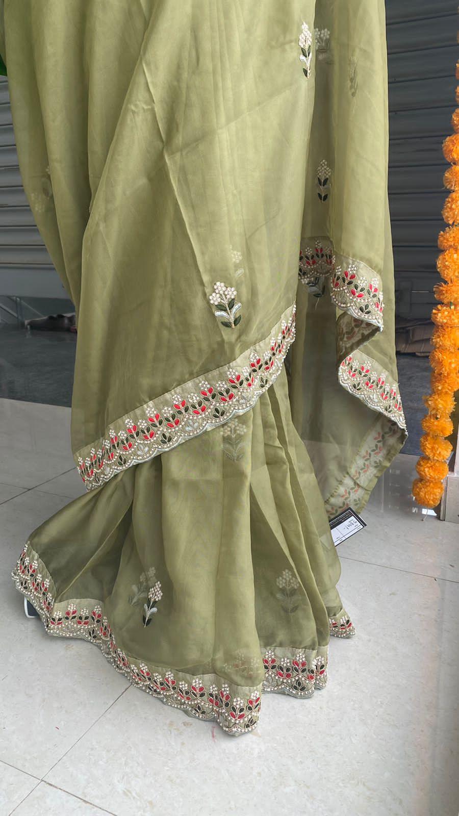 Mehandi green organza saree with silk embroidery blouse - Threads