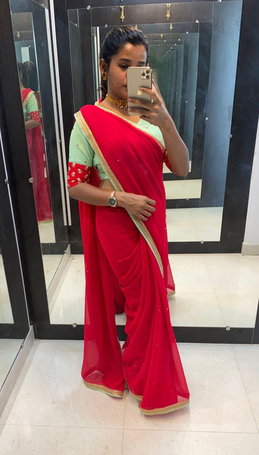 Red Georgette saree with sea green designer blouse - Threads