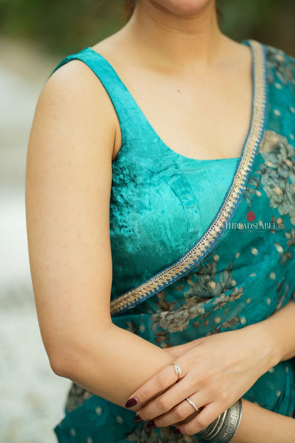 Peacock blue organza saree with velvet blouse
