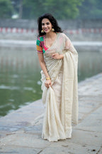 Beige georgette tissue saree with multi hand work blouse