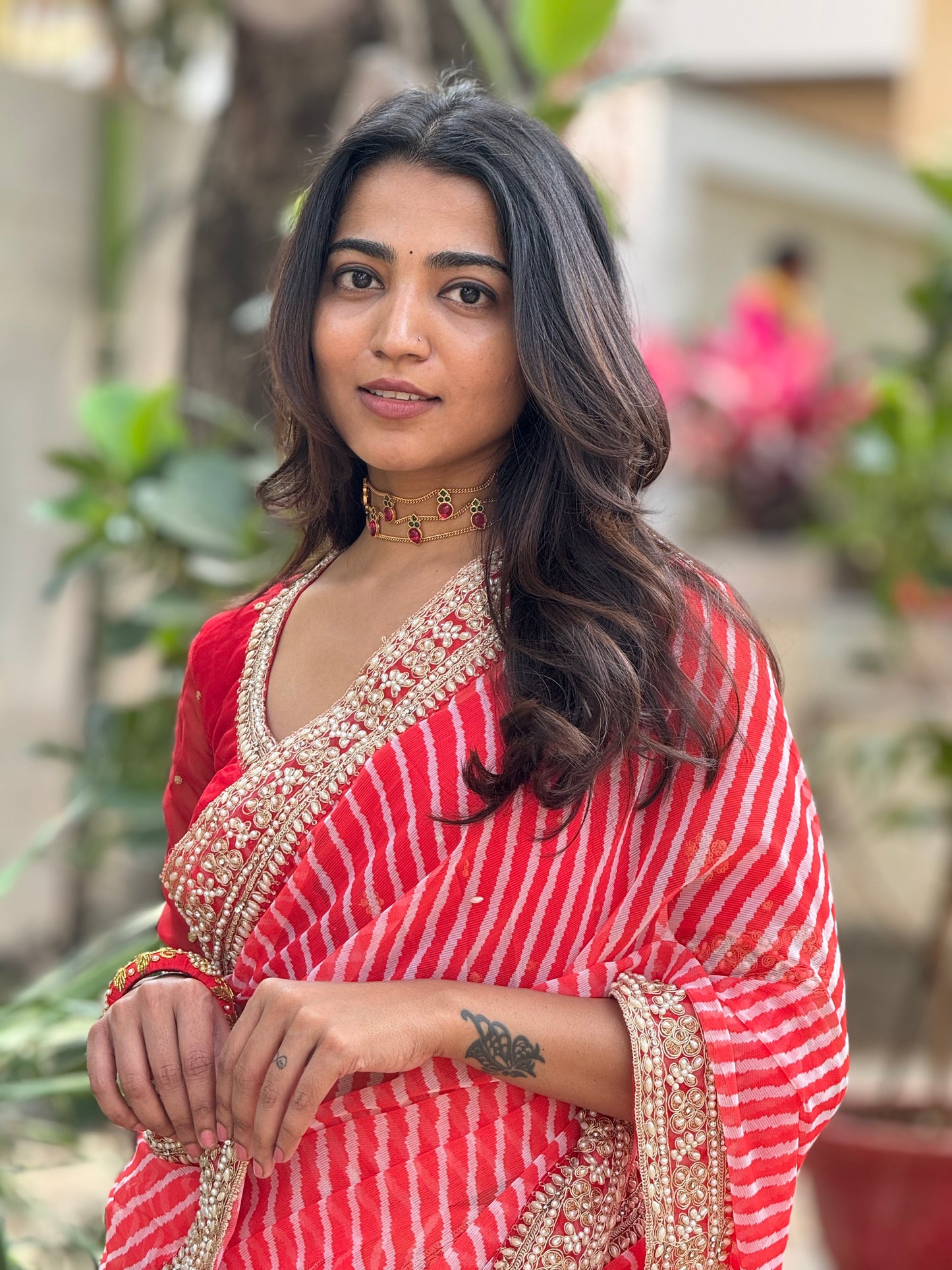 Reddish georgette lehariya saree with handwork blouse