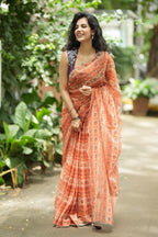 Pastel peach chiffon saree with brown hand work blouse