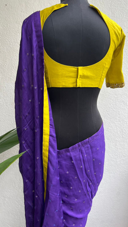 Purple soft jute saree with yellow JEWEL neck hand work blouse