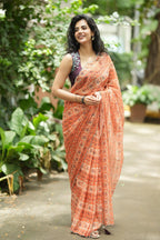 Pastel peach chiffon saree with brown hand work blouse