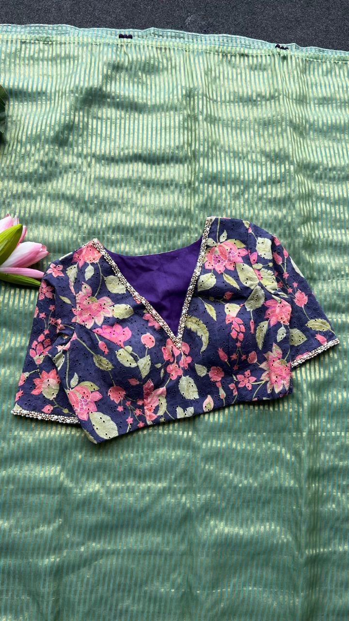 Green stripped tissue saree with purple floral hand work blouse