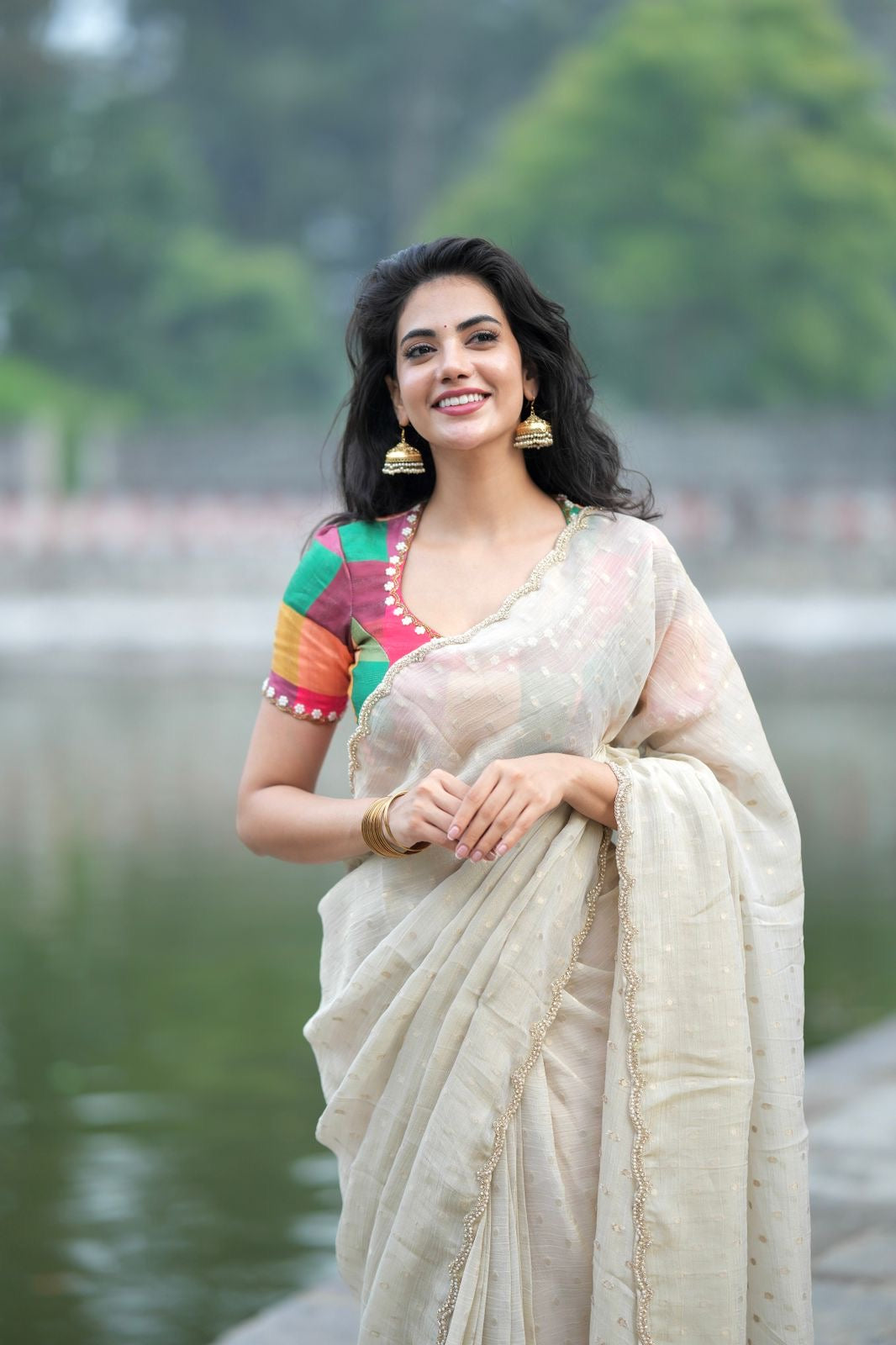 Beige georgette tissue saree with multi hand work blouse